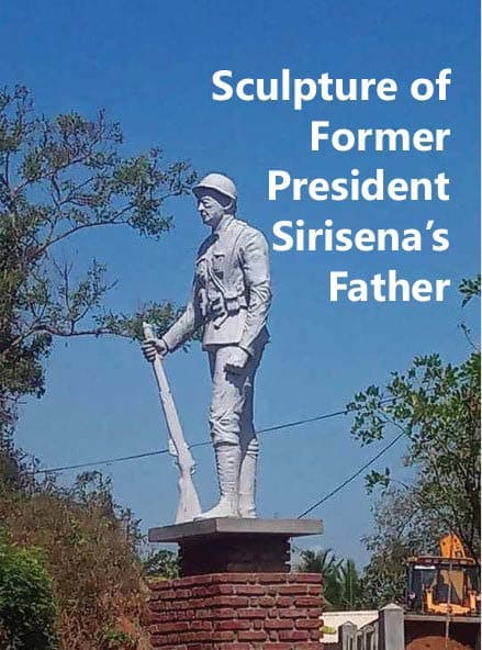 Six-foot concrete statue of a soldier in uniform standing at attention inside Ranaviru Park